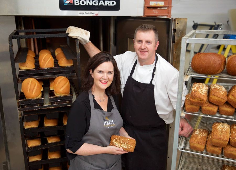 Jinny's Bakery artisan bakers surrounded by freshly baked loaves